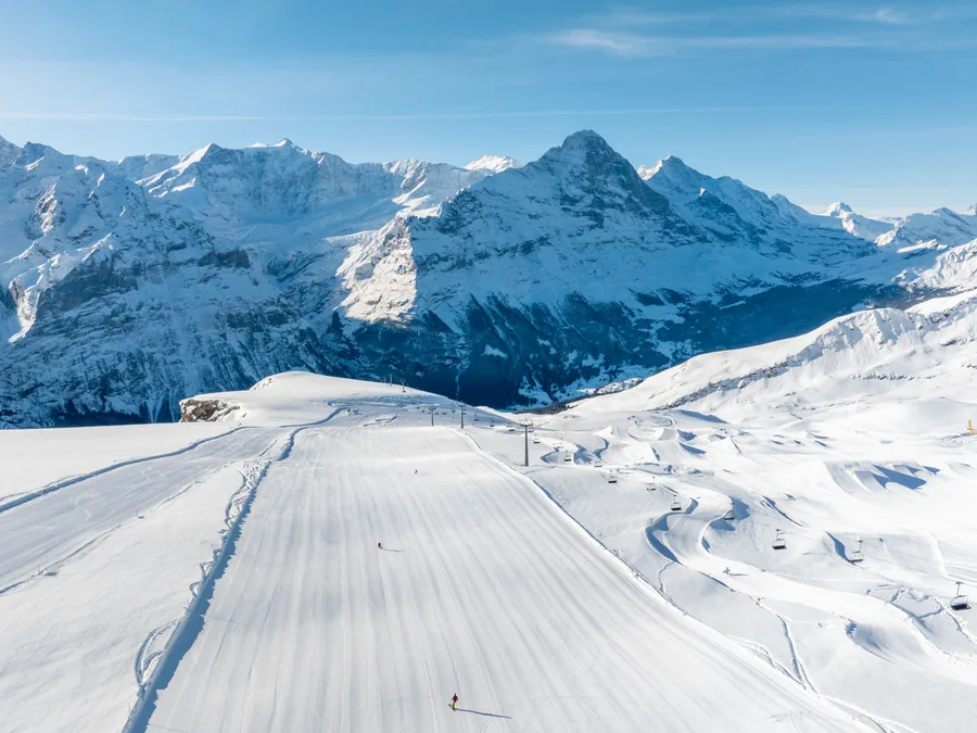 Freshly groomed piste and snowpark at Grindelwald–First above the valley, Eiger behind