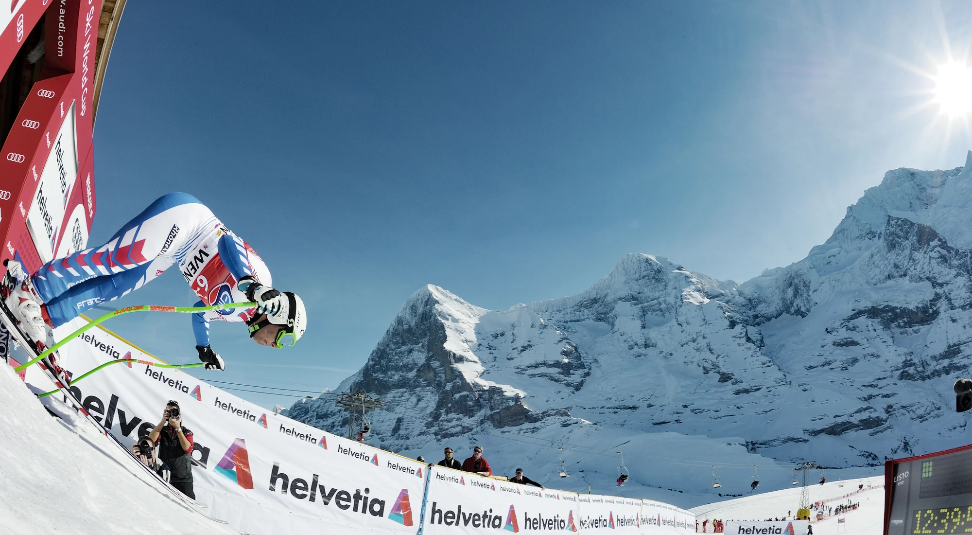 Ski racer launching from the Lauberhorn World Cup start above Wengen with the Eiger behind, Lauterbrunnen region