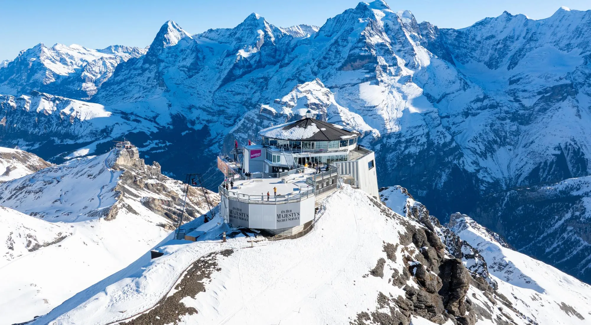 Schilthorn Piz Gloria summit station above Mürren with the snow-covered Jungfrau Alps behind, Lauterbrunnen region